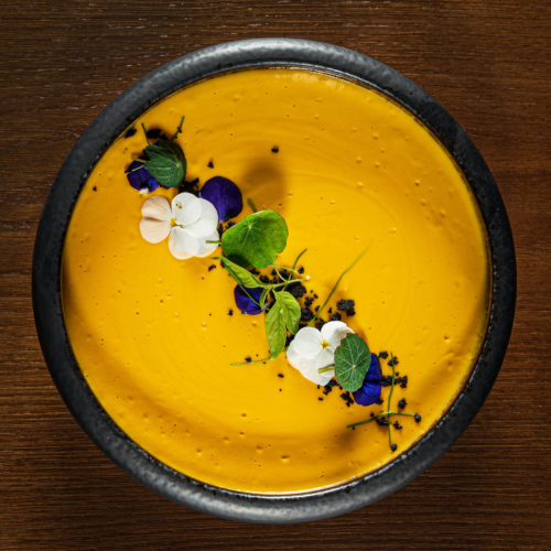 carrot cream soup with microgreens